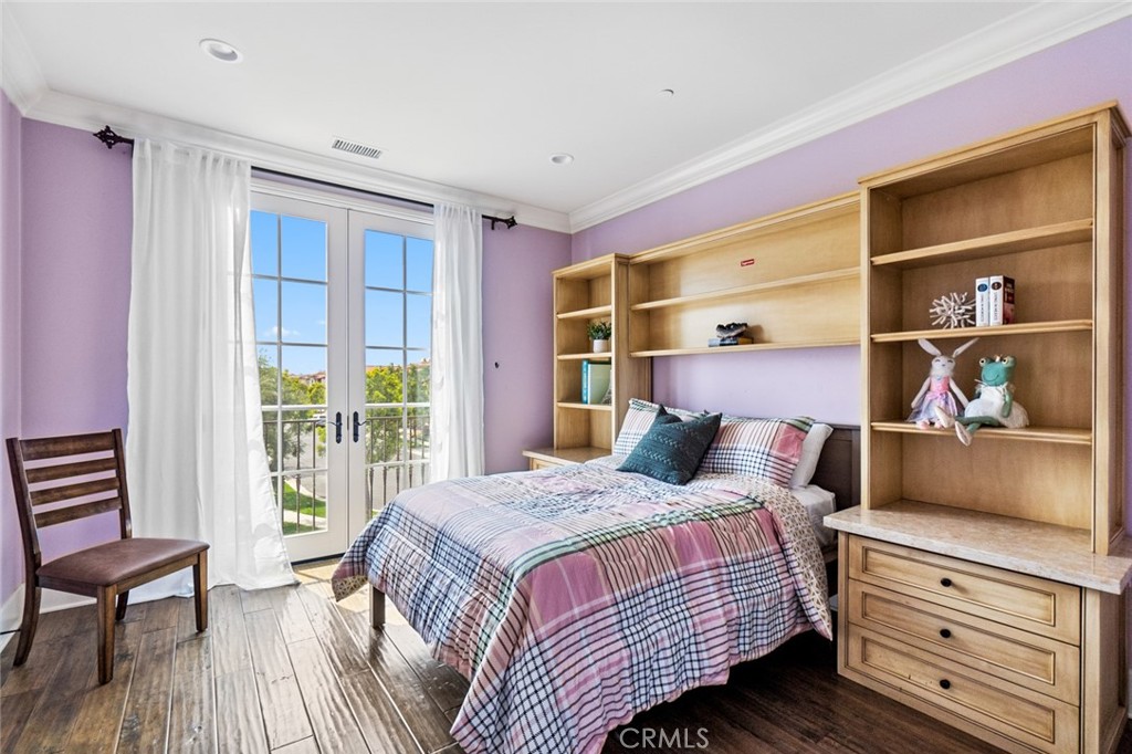 121 Treasure Irvine, CA 92602 - Photo 23 of 41 a bedroom with a bed and a dresser next to a window