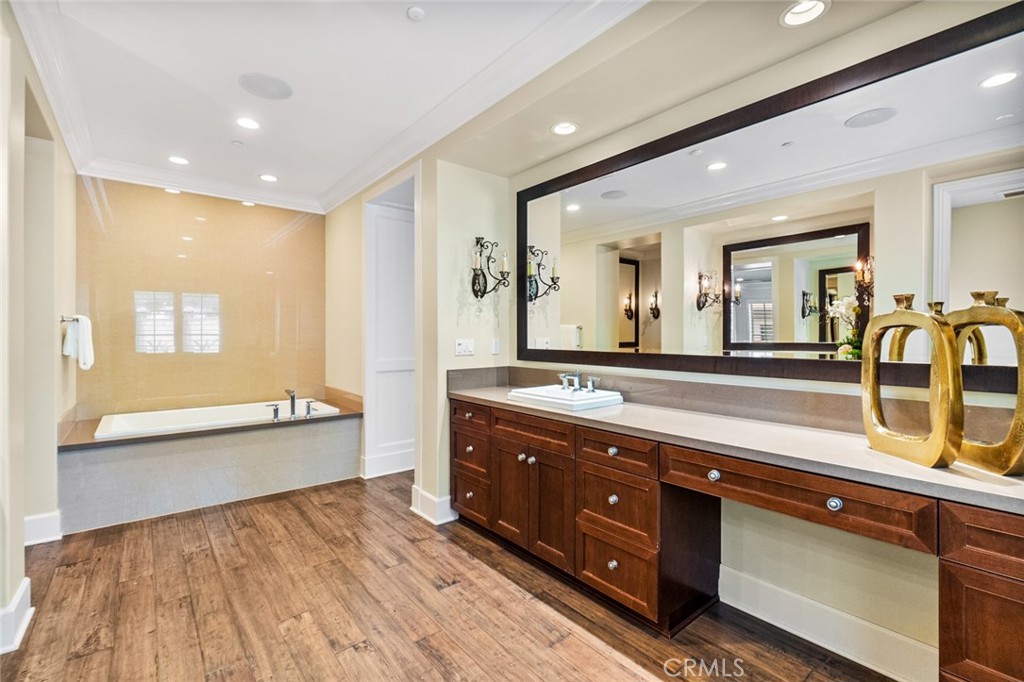 121 Treasure Irvine, CA 92602 - Photo 28 of 41 a spacious bathroom with a granite countertop double vanity sink a mirror and a bathtub