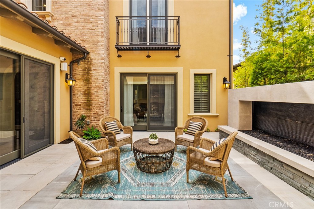 121 Treasure Irvine, CA 92602 - Photo 30 of 41 a view of a patio with couple of chairs and a couch