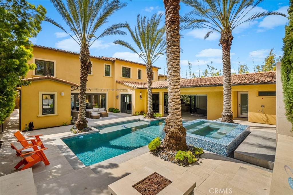 121 Treasure Irvine, CA 92602 - Photo 32 of 41 a front view of a house with garden and patio