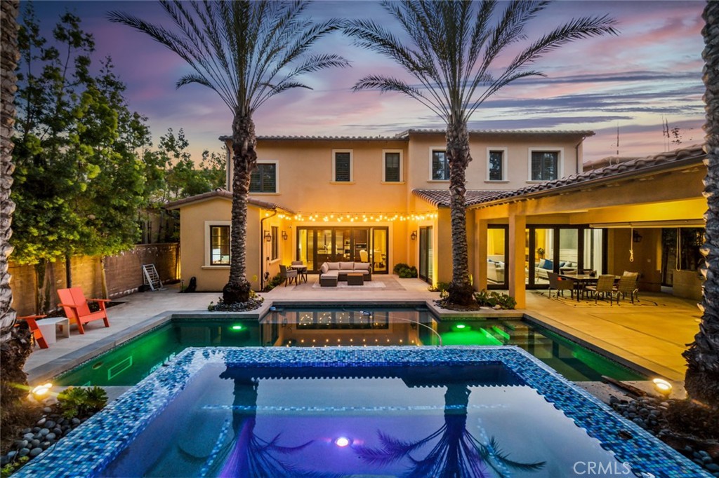 121 Treasure Irvine, CA 92602 - Photo 38 of 41 a front view of a house with swimming pool garden and patio