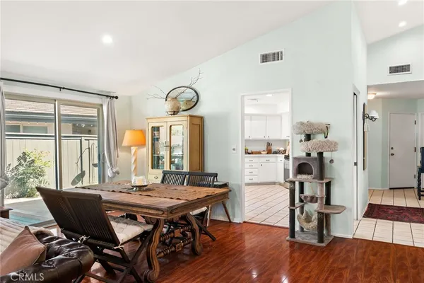 a view of a dining room with furniture window and wooden floor