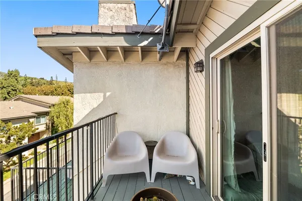 a view of balcony with furniture