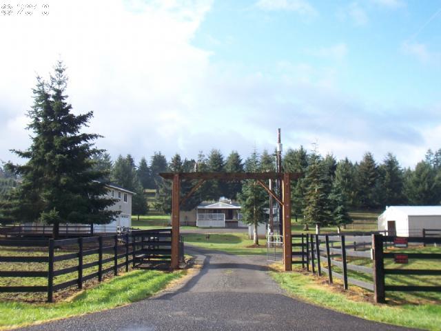 a view of a park with iron fence