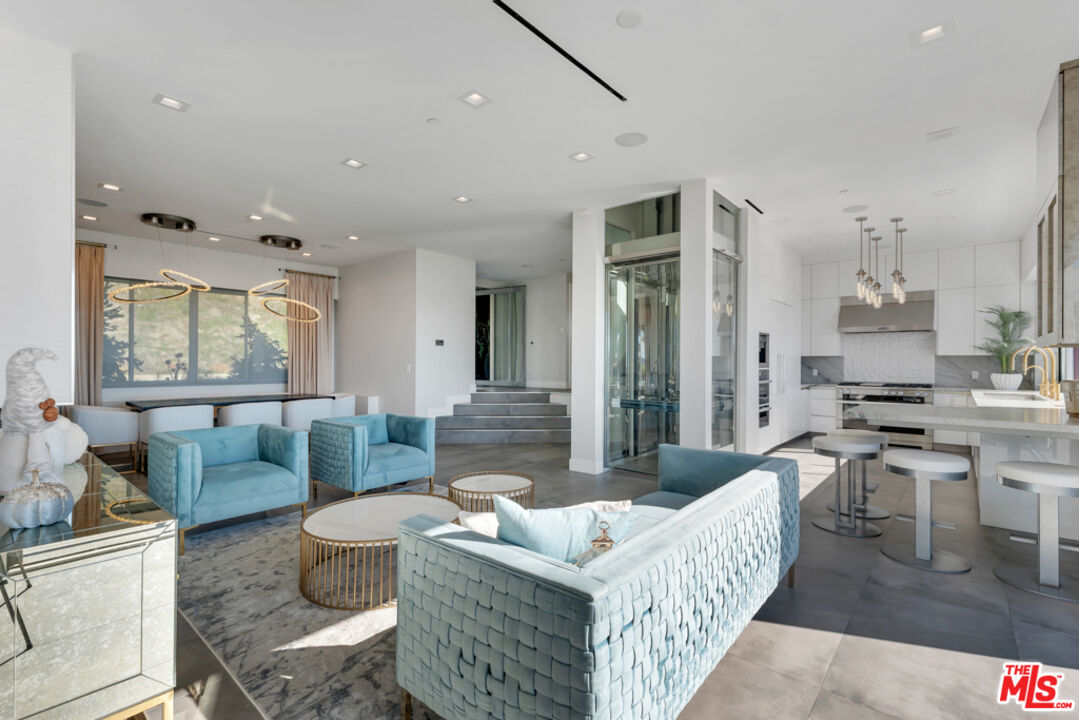 25423 Malibu Road Malibu, CA 90265 - Photo 15 of 71 a living room with furniture and a large window