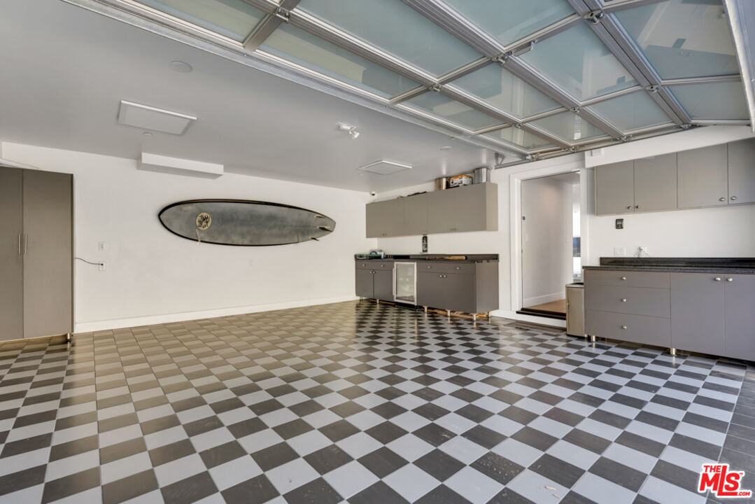 25423 Malibu Road Malibu, CA 90265 - Photo 43 of 71 a view of a kitchen with a sink and a cabinets