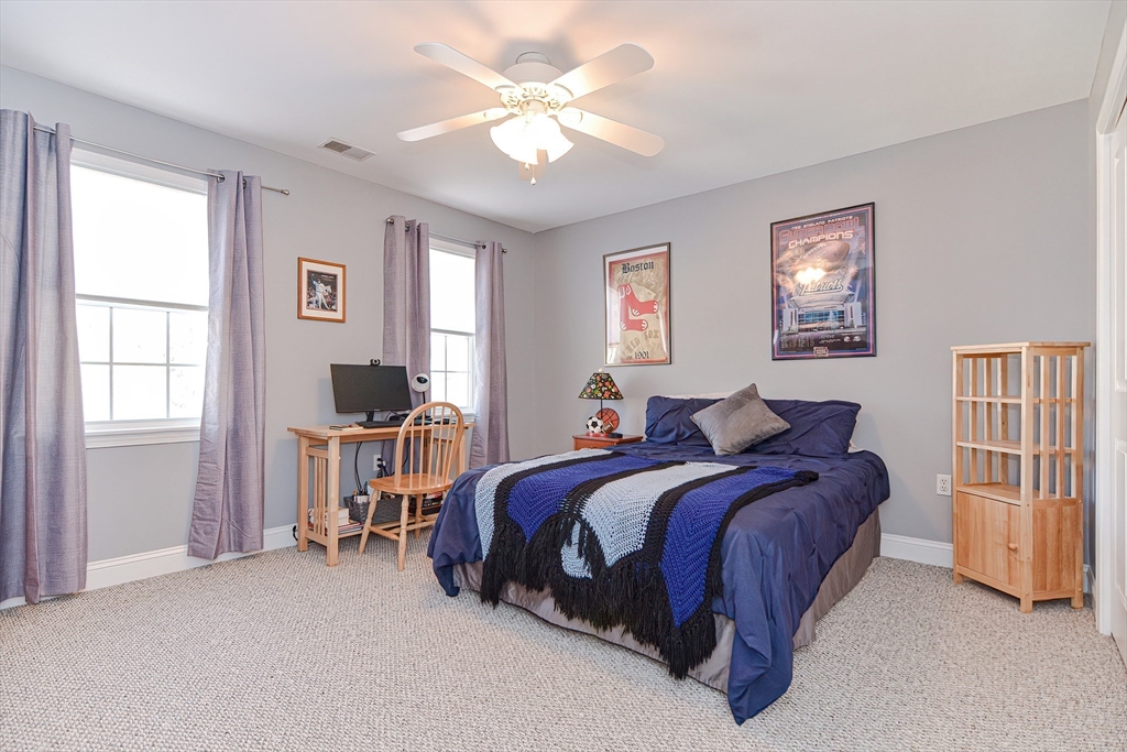 14 Frankland Road Ashland, MA 01721 - Photo 24 of 42 a bed room with a bed and a chair