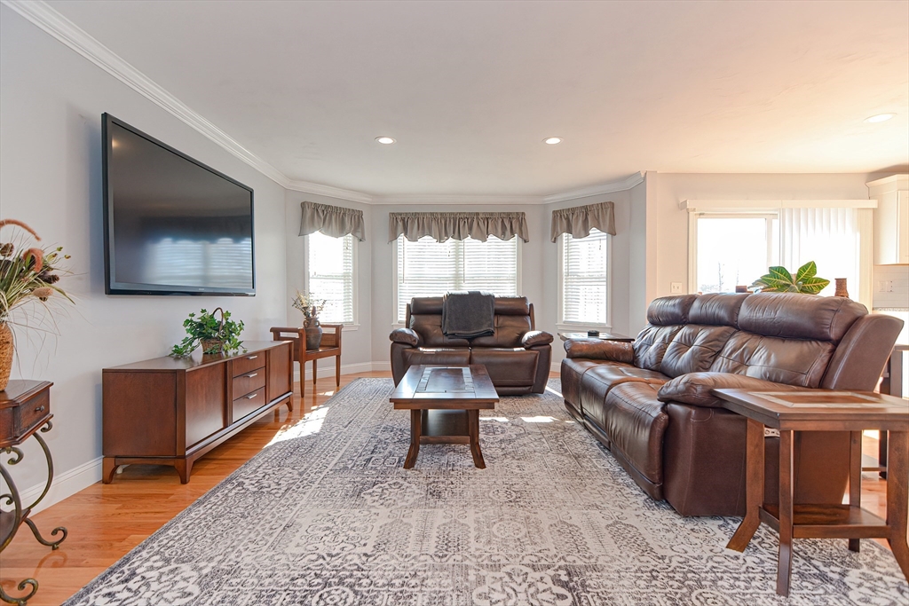 14 Frankland Road Ashland, MA 01721 - Photo 10 of 42 a living room with furniture and a flat screen tv