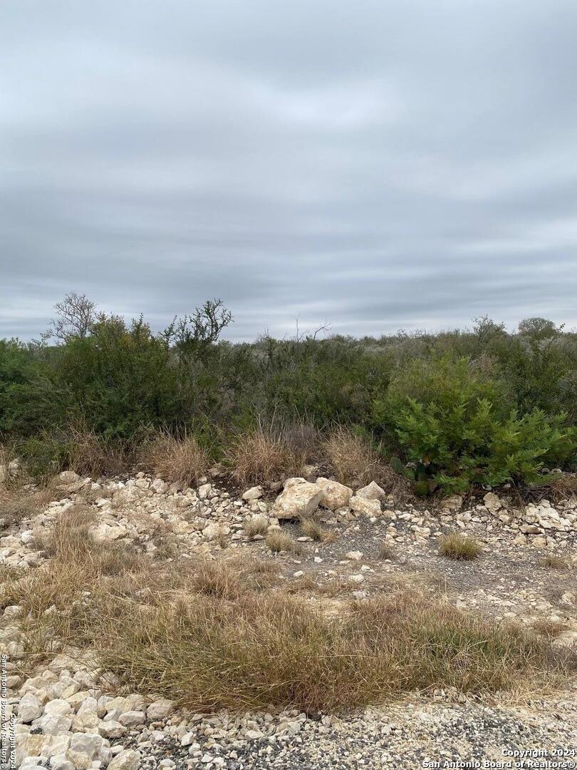 264 Legend Hills Uvalde, TX 78801 - Photo 2 of 6 a view of a lake with mountain in the back