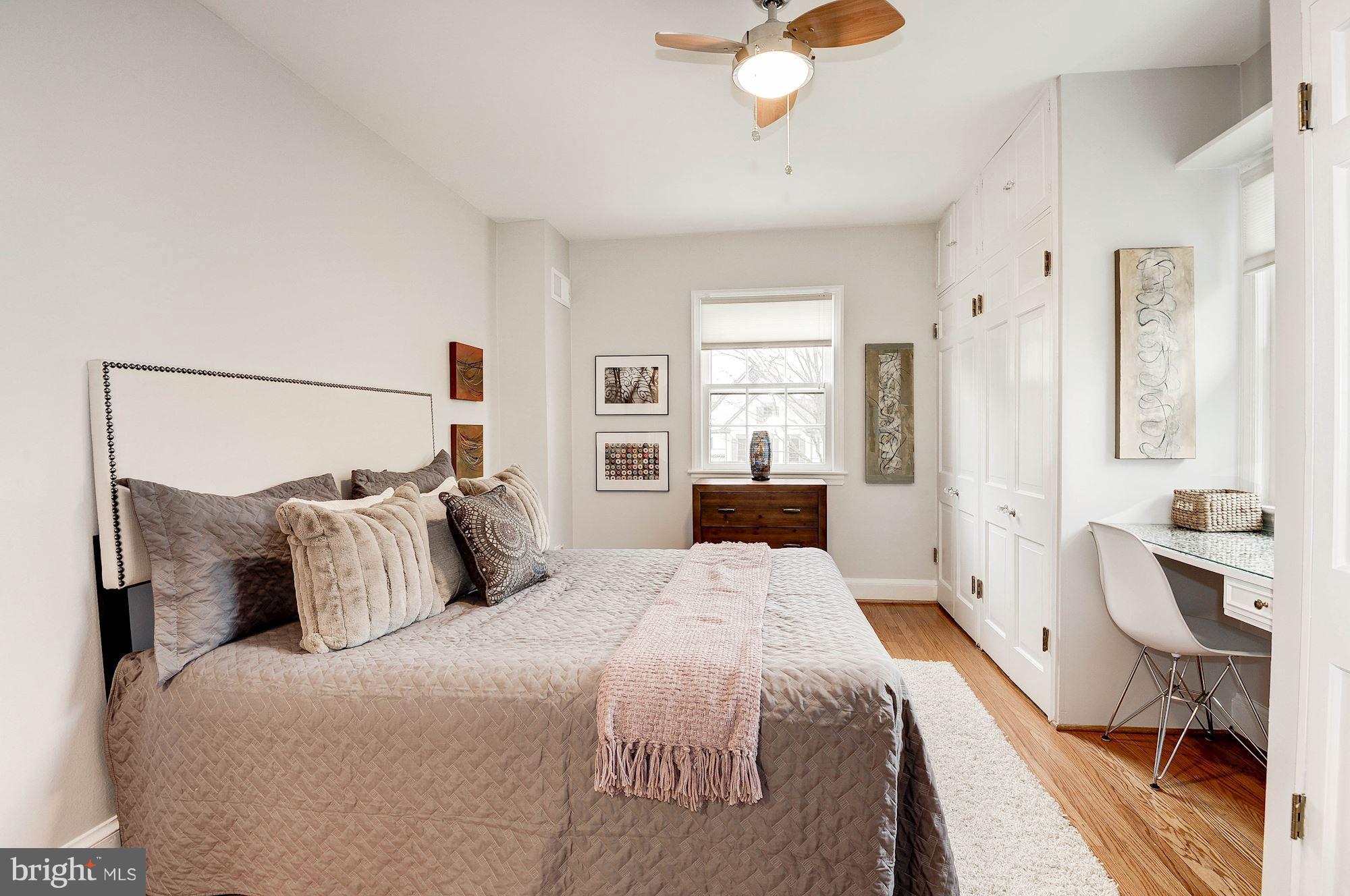 5000 Park Place Bethesda, MD 20816 - Photo 12 of 30 a bedroom with a bed and a chandelier