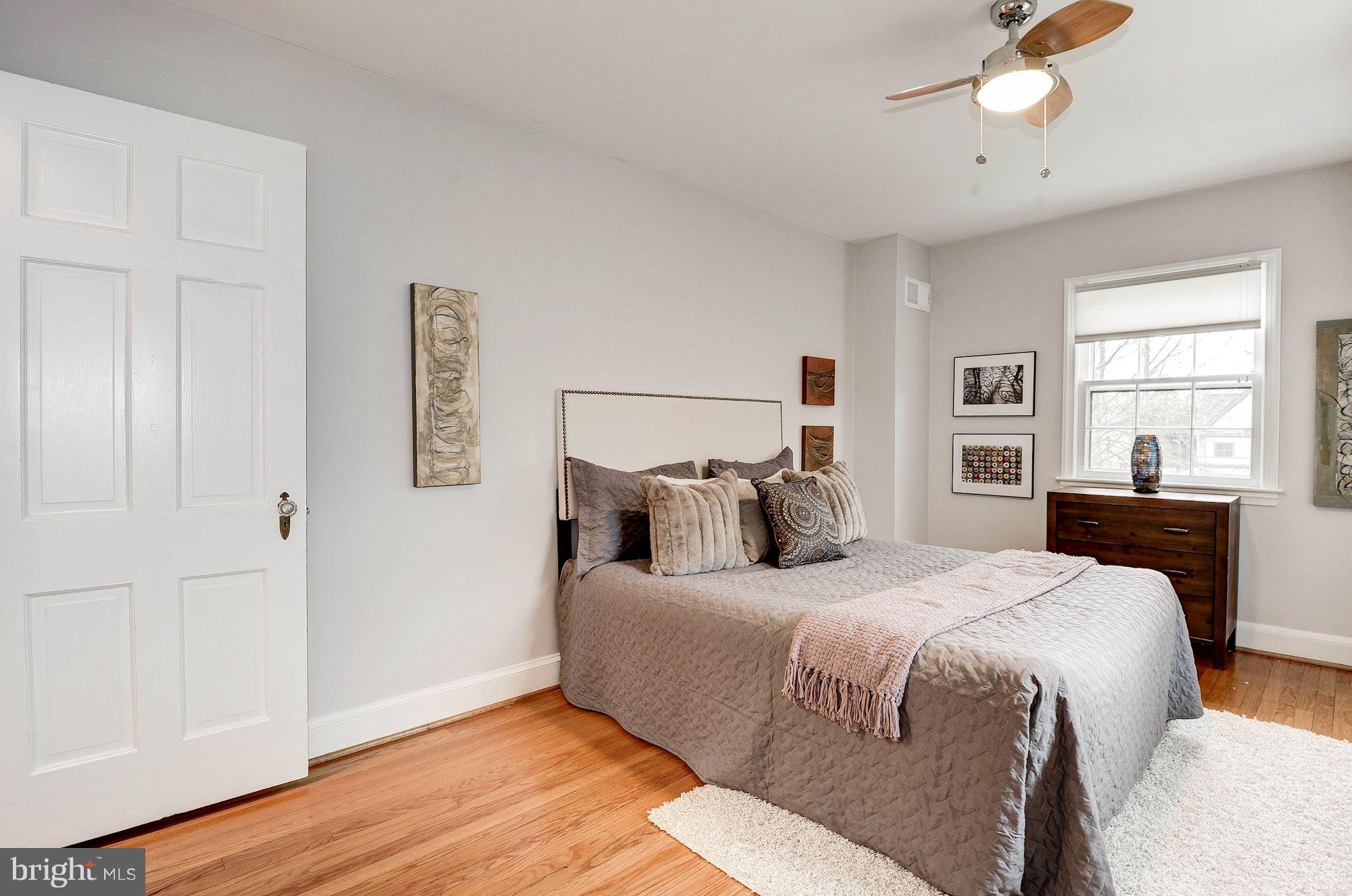 5000 Park Place Bethesda, MD 20816 - Photo 13 of 30 a bedroom with a bed and wooden floor