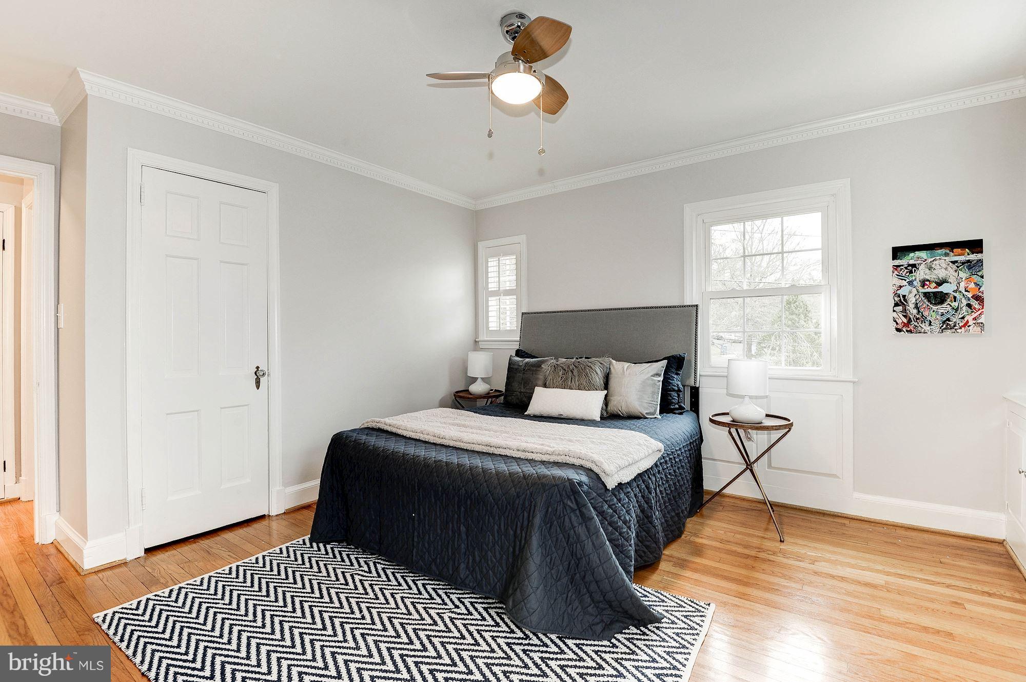 5000 Park Place Bethesda, MD 20816 - Photo 15 of 30 a bedroom with a bed lamp and a window