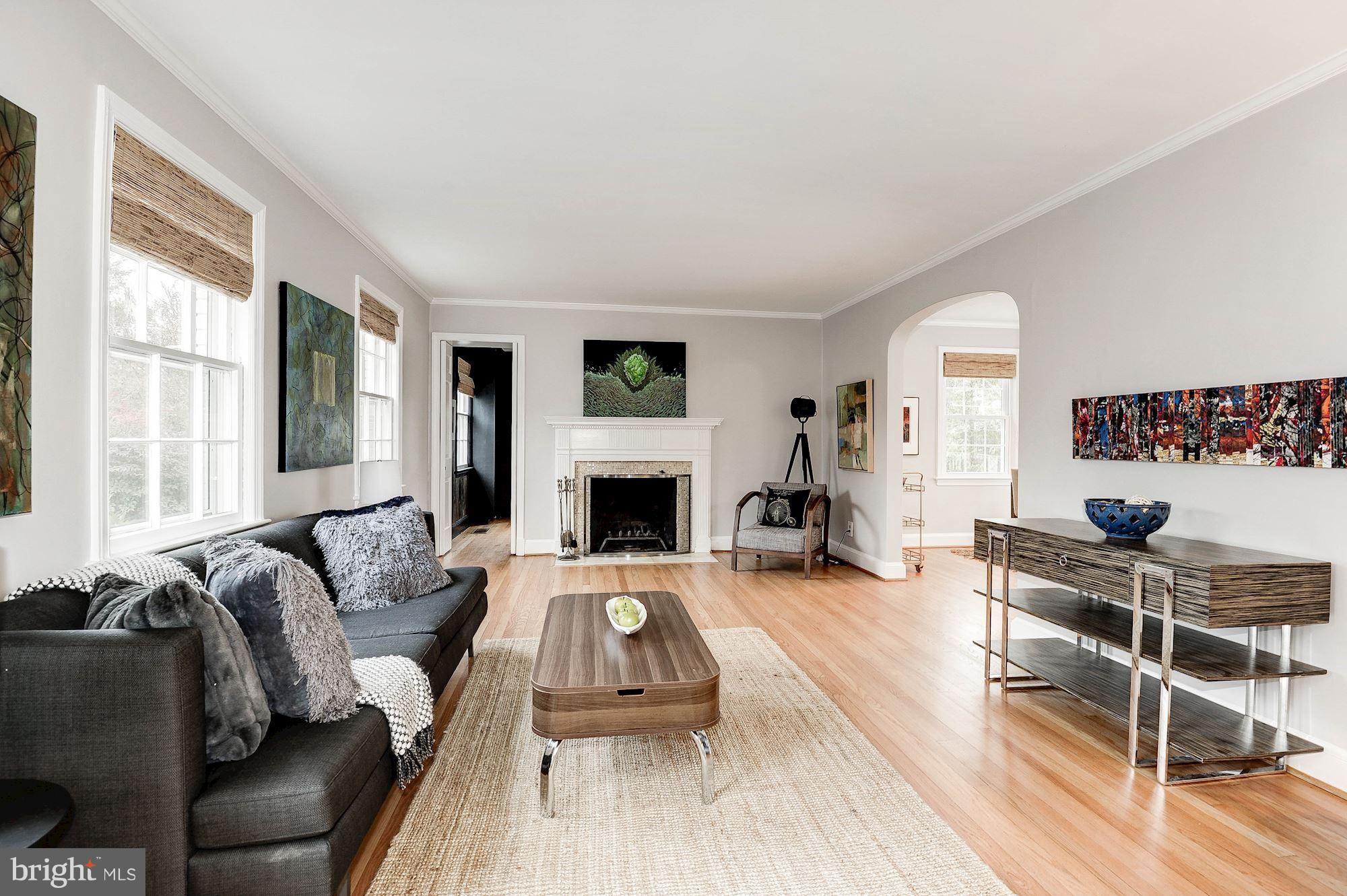 5000 Park Place Bethesda, MD 20816 - Photo 5 of 30 a living room with furniture a fireplace and a large window