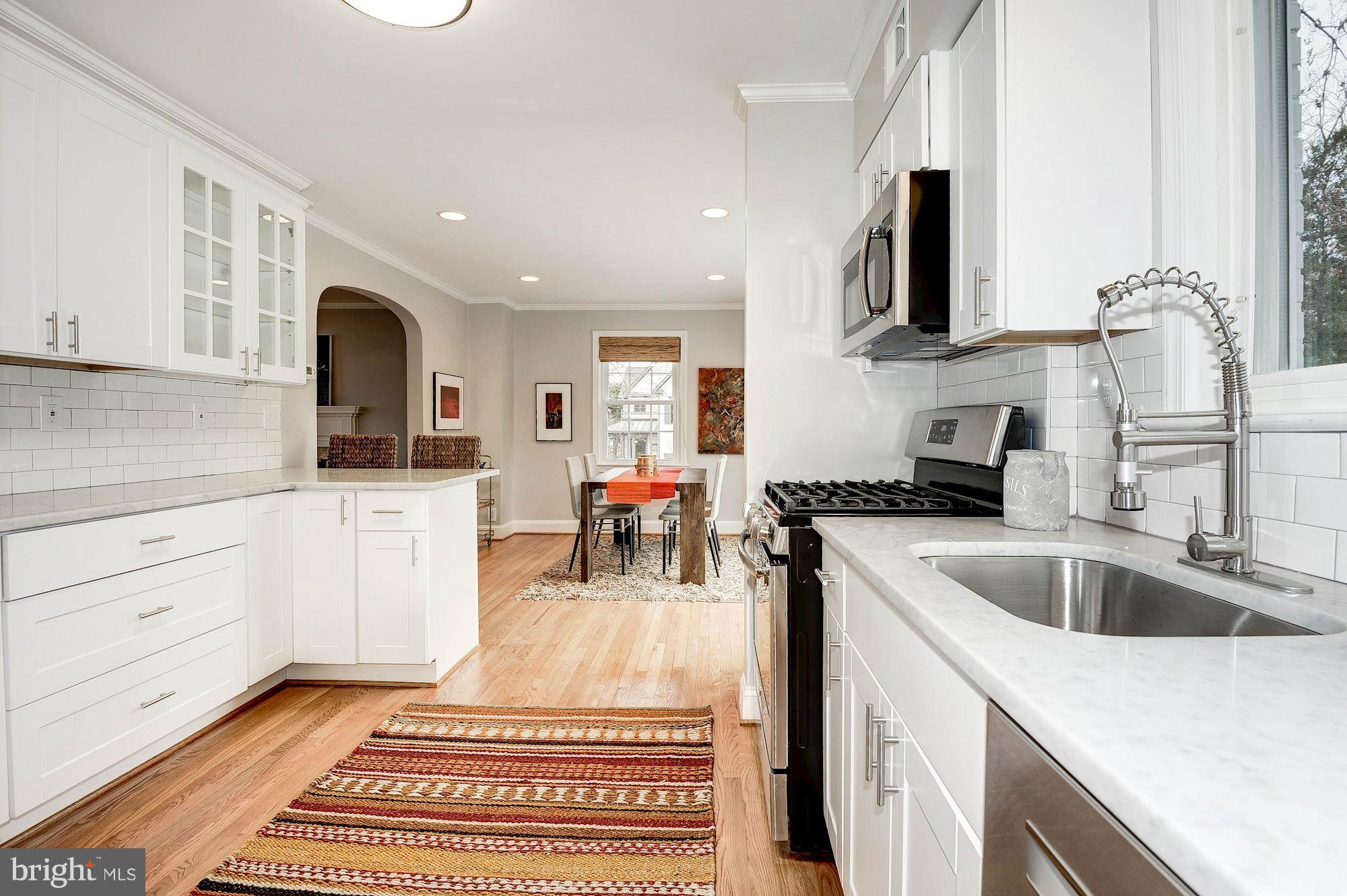 5000 Park Place Bethesda, MD 20816 - Photo 8 of 30 a kitchen with a sink stove and cabinets