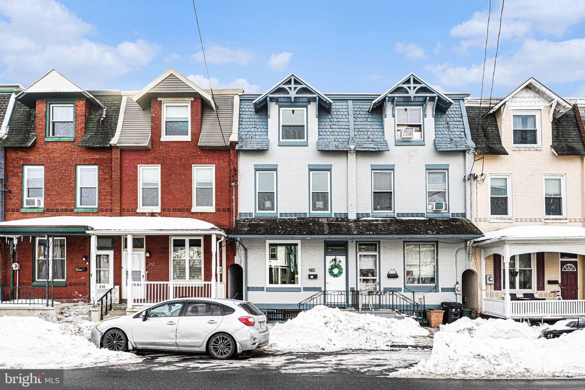 214 Chestnut Street Lebanon, PA 17042 - Photo 2 of 45 a front view of a residential apartment building with a yard