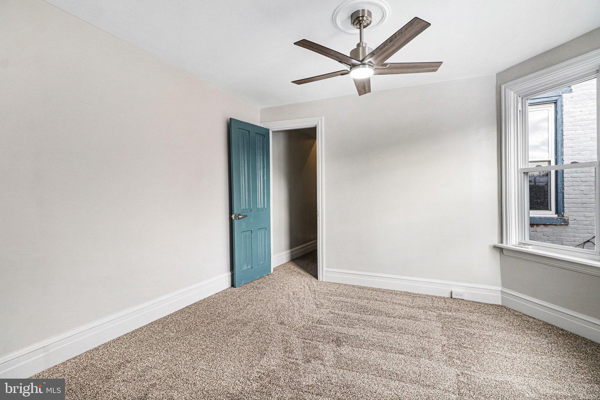 214 Chestnut Street Lebanon, PA 17042 - Photo 25 of 45 a view of a livingroom with a ceiling fan and window
