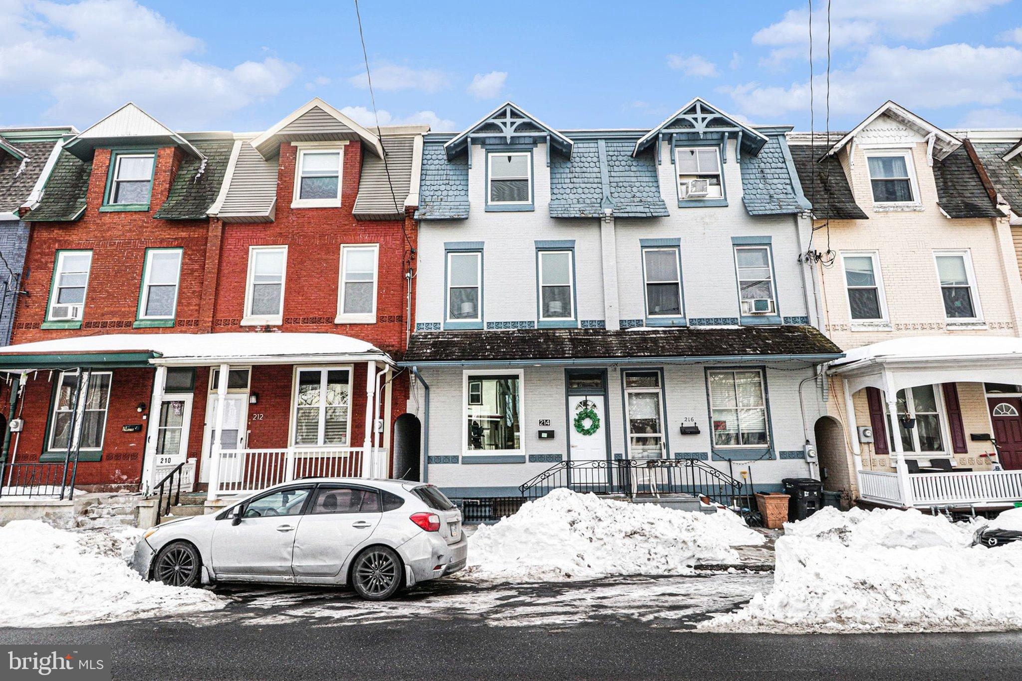 214 Chestnut Street Lebanon, PA 17042 - Photo 3 of 45 a front view of a residential apartment building with a yard
