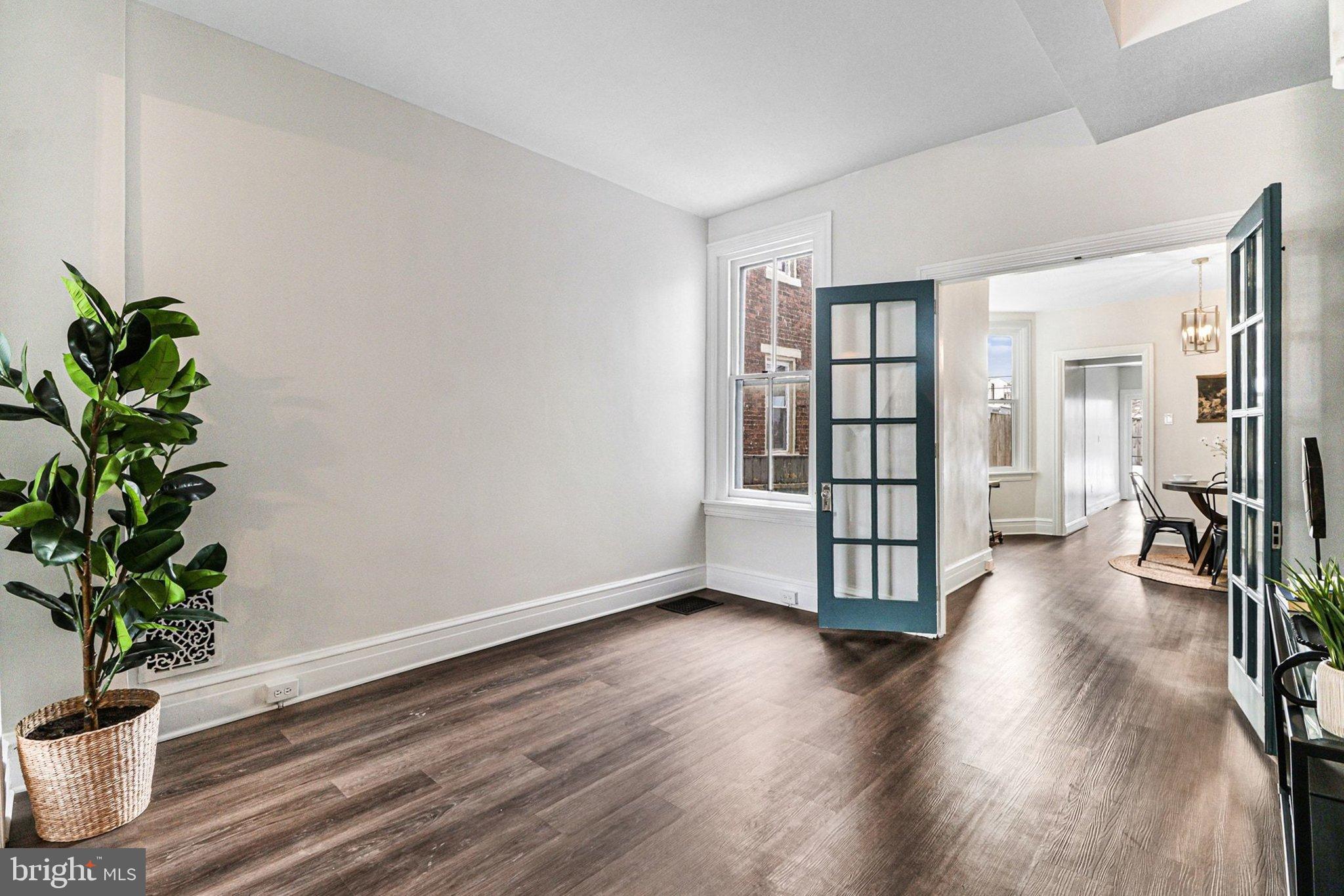 214 Chestnut Street Lebanon, PA 17042 - Photo 9 of 45 a view of an empty room with wooden floor and a potted plant