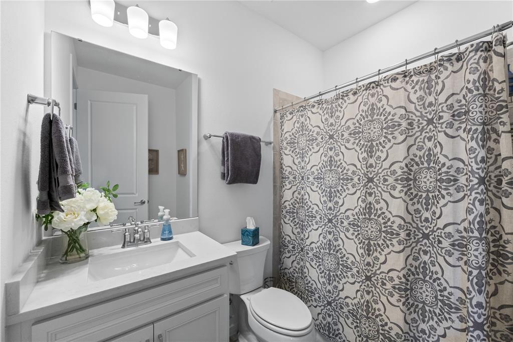 10646 Spring Tide Way Palmetto, FL 34221 - Photo 20 of 35 Quartz top vanity in guest bathroom