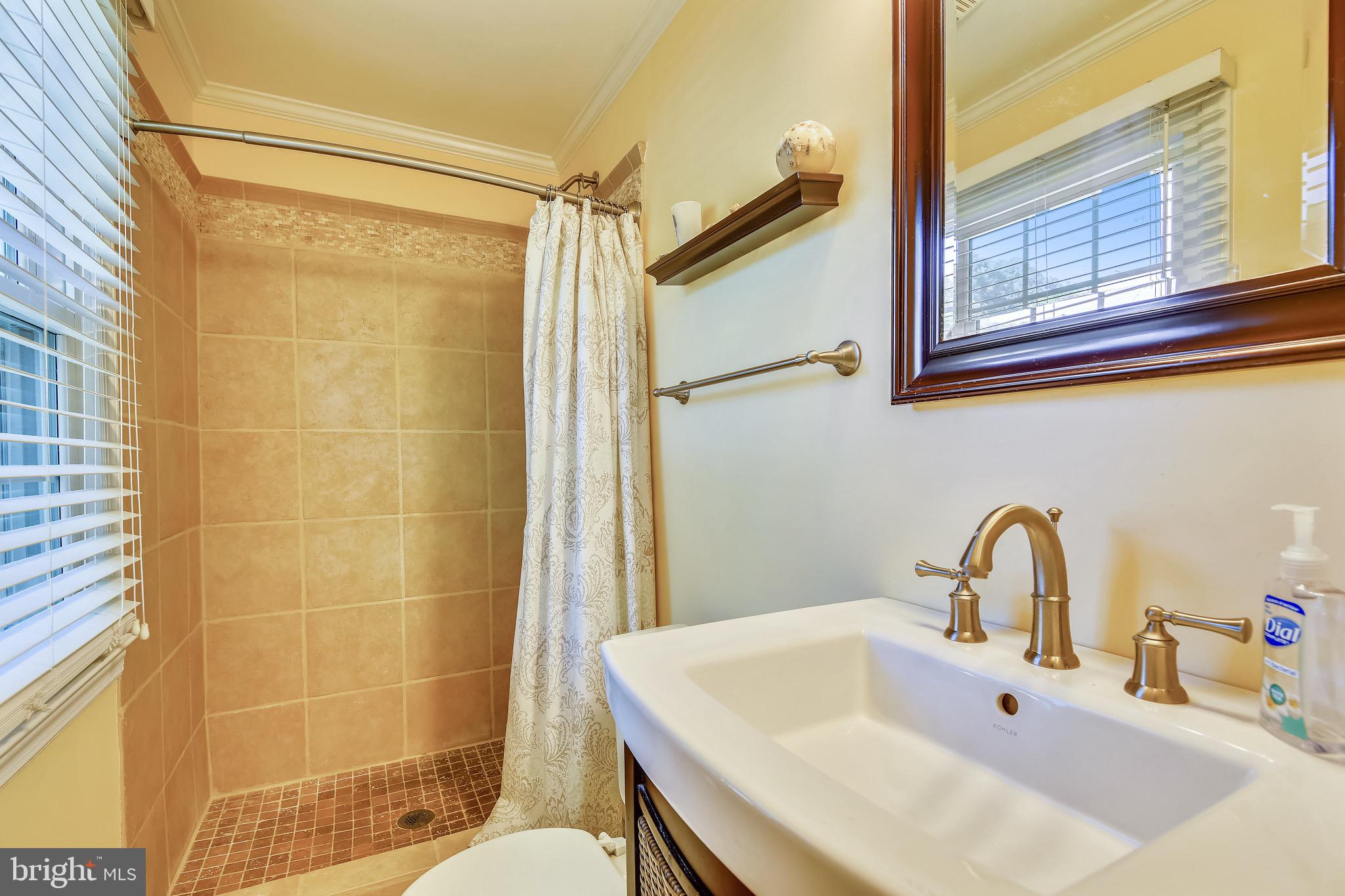 4 Severndale Road Severna Park, MD 21146 - Photo 23 of 44 Primary bathroom has tile shower.