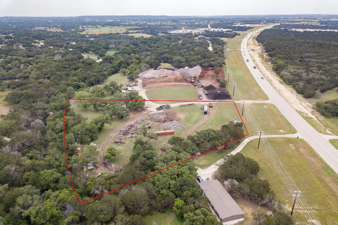 25585 Ronald Reagan Boulevard Georgetown, TX 78633 - Photo 13 of 17 an aerial view of residential houses with outdoor space