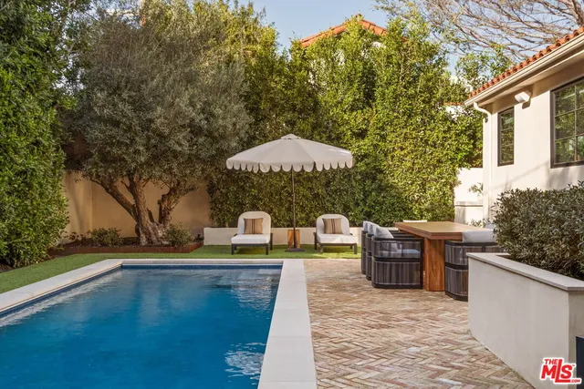 a view of house with outdoor space and seating area