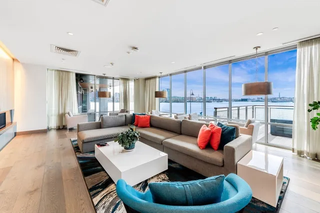 a living room with furniture and a rug