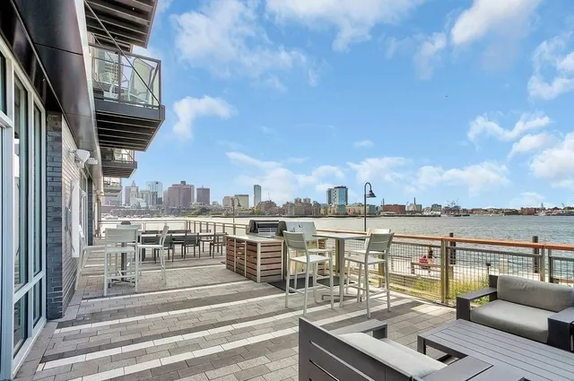 a view of roof deck with patio