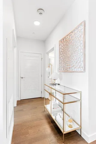 a view of a kitchen with wooden floor