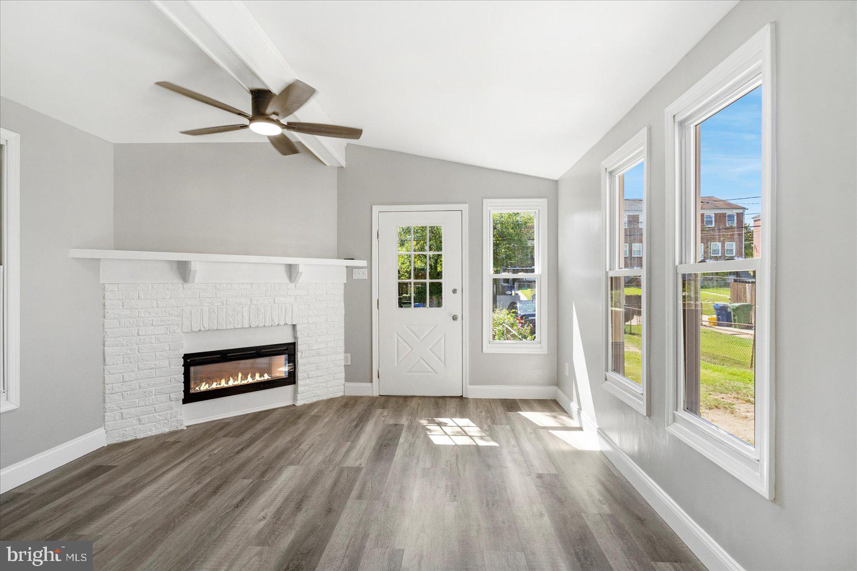1607 Walterswood Road Baltimore, MD 21239 - Photo 20 of 44 wooden floor in an empty room with a window