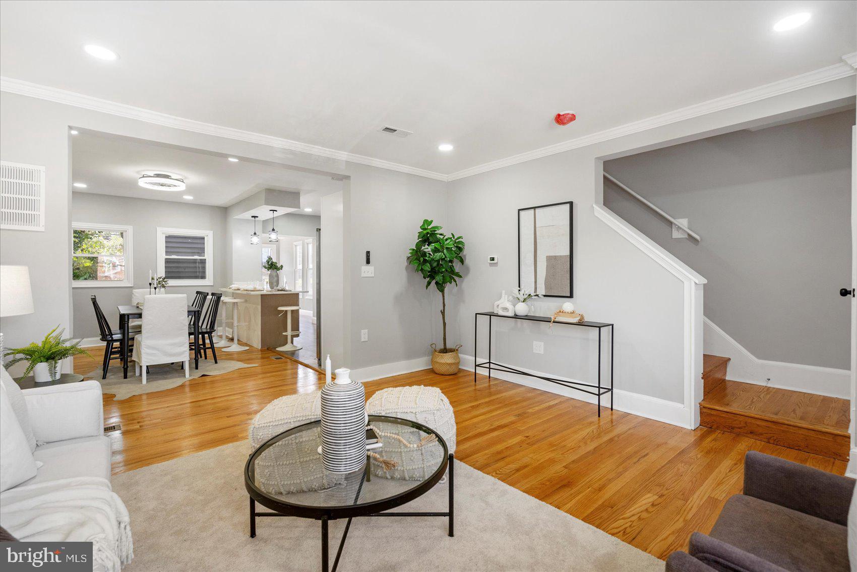 1607 Walterswood Road Baltimore, MD 21239 - Photo 7 of 44 a living room with furniture and a dining table
