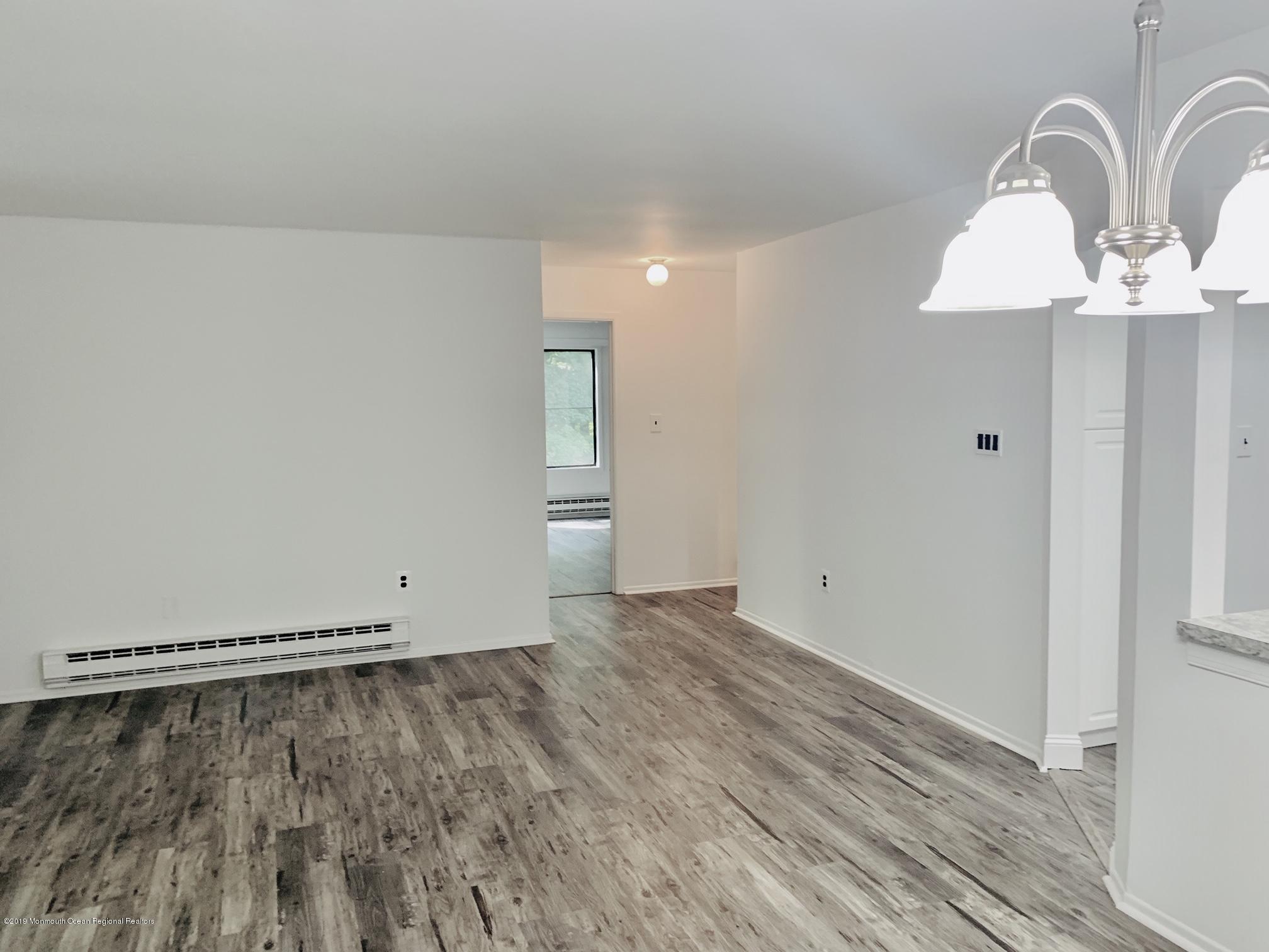 31 Lexington Court Red Bank, NJ 07701 - Photo 3 of 21 wooden floor in an empty room