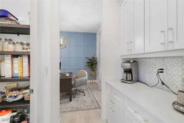 a bedroom with a bed and a view of bathroom