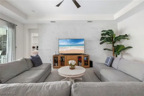 a bathroom with a granite countertop bathtub a sink and a mirror