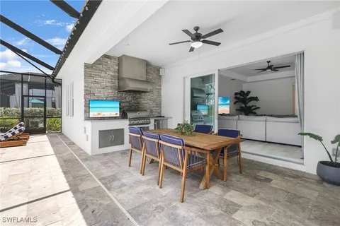 an aerial view of a swimming pool with a lake view
