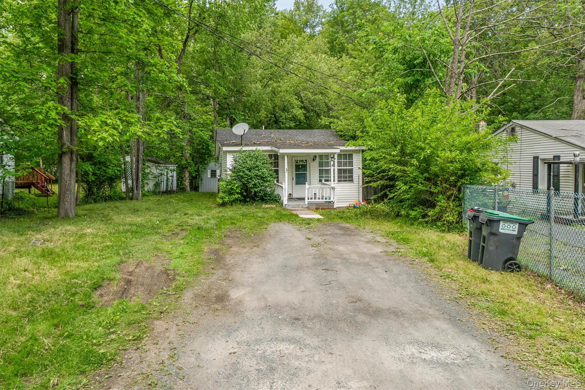 359 Lake Shore Drive Pine Bush, NY 12566 - Photo 2 of 25 View of front facade with driveway and a porch