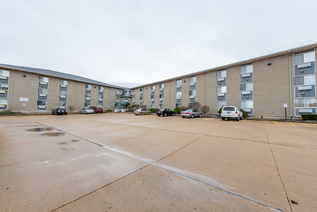 3305 Sunset Avenue, Unit 305 Waukegan, IL 60087 - Photo 2 of 23 a cars parked in front of a building