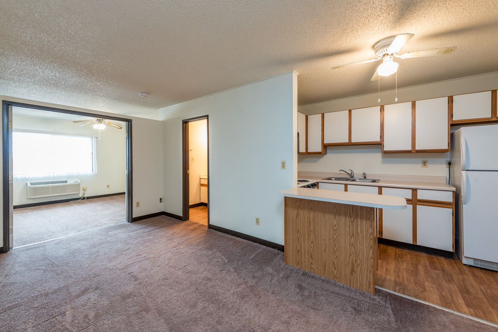 3305 Sunset Avenue, Unit 305 Waukegan, IL 60087 - Photo 5 of 23 a view of a kitchen with a sink and dishwasher a stove top oven with wooden floor