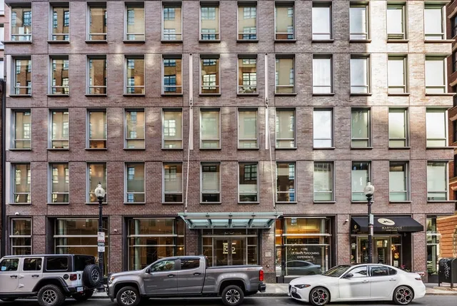 a front view of a building with parking space