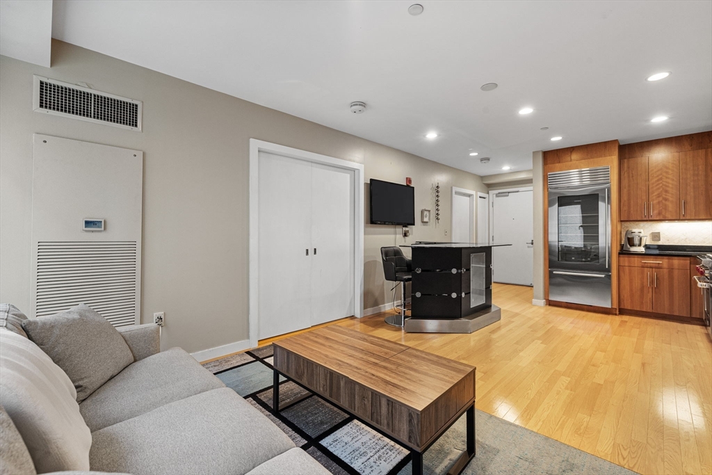 80 Broad Street, Unit 805 Boston, MA 02110 - Photo 7 of 22 a room with furniture pool table and flat screen tv