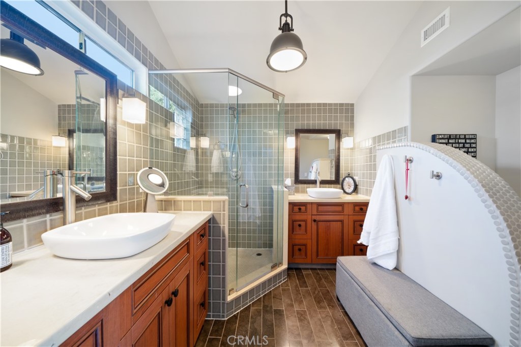 53 Saratoga Newport Beach, CA 92660 - Photo 17 of 31 a bathroom with a sink a vanity and mirror