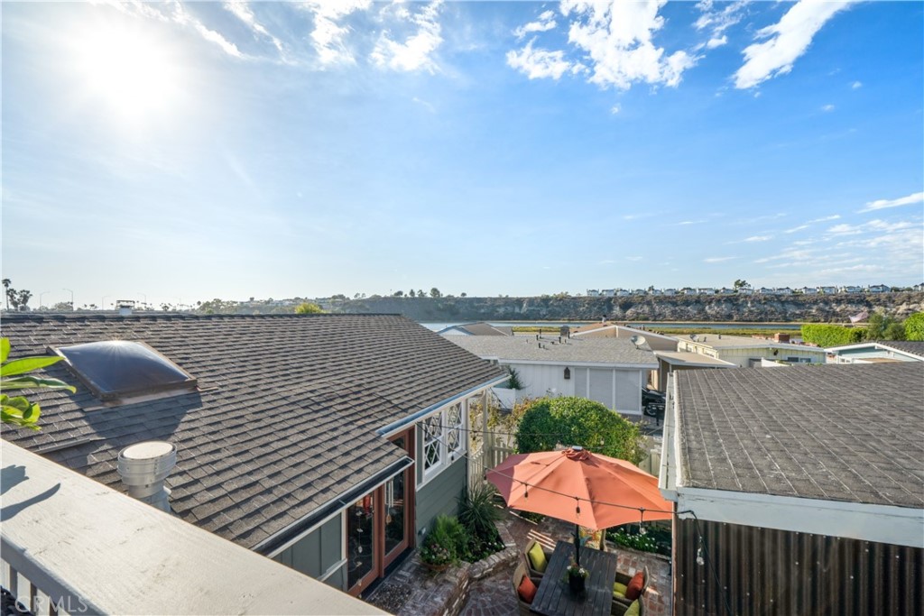 53 Saratoga Newport Beach, CA 92660 - Photo 23 of 31 a terrace with outdoor seating and city view