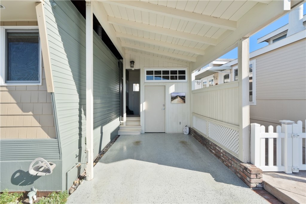53 Saratoga Newport Beach, CA 92660 - Photo 4 of 31 Attached car port with lock up storage room.