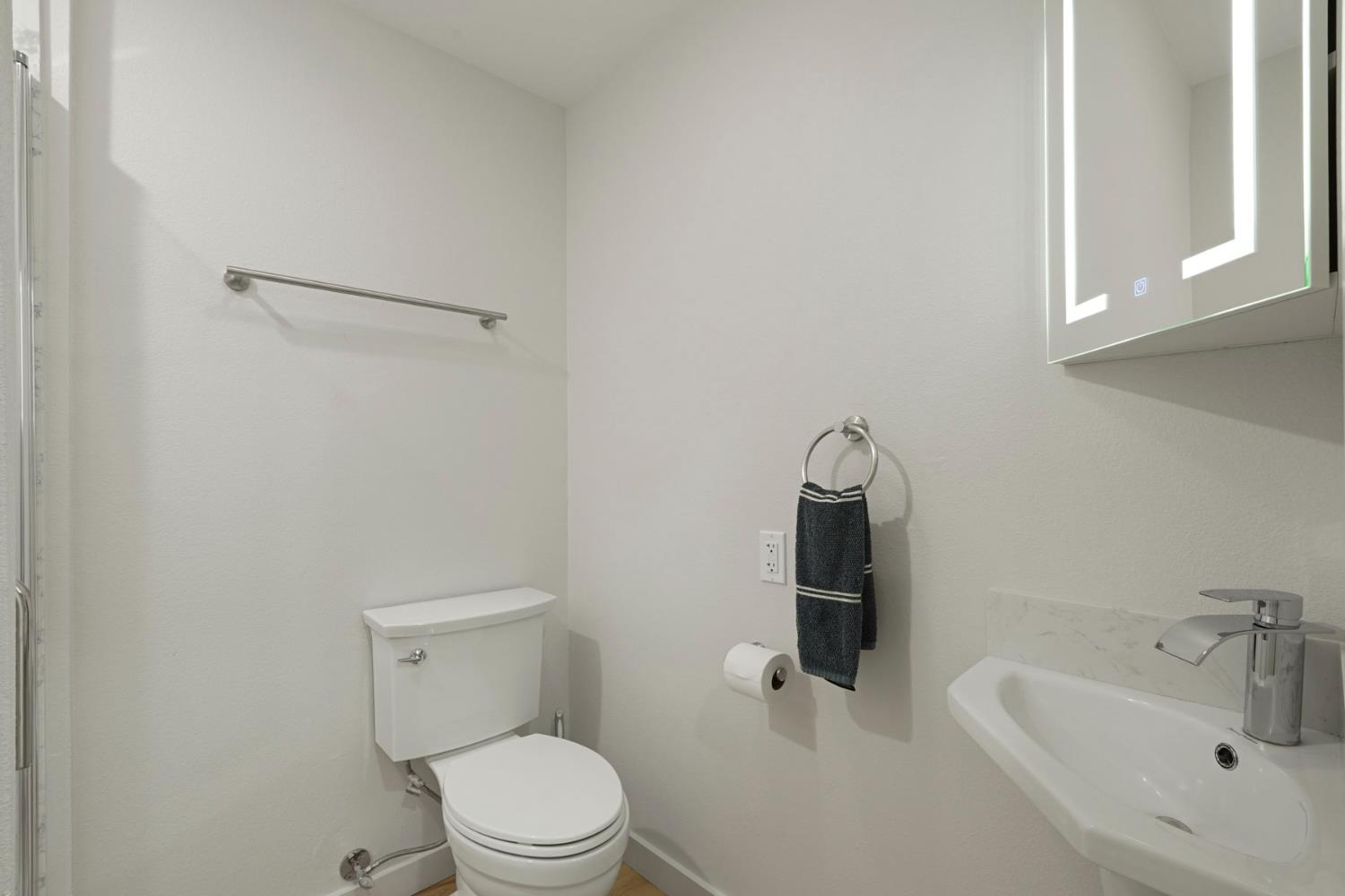 2650 West Twitchell Island Road Rio Vista, CA 94571 - Photo 52 of 60 a white toilet sitting next to a bathroom sink