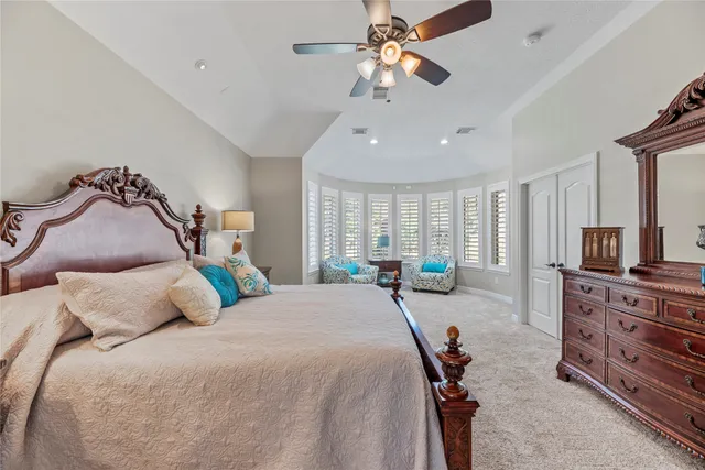 a bedroom with bed and window