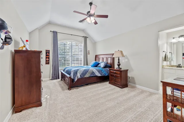 a bedroom with a bed dresser and a window