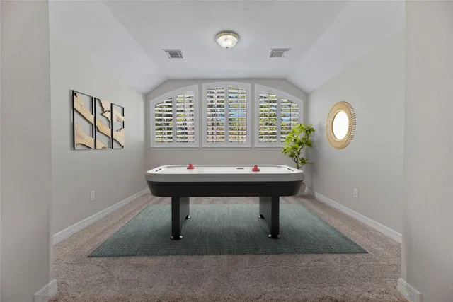 a room with furniture table and window