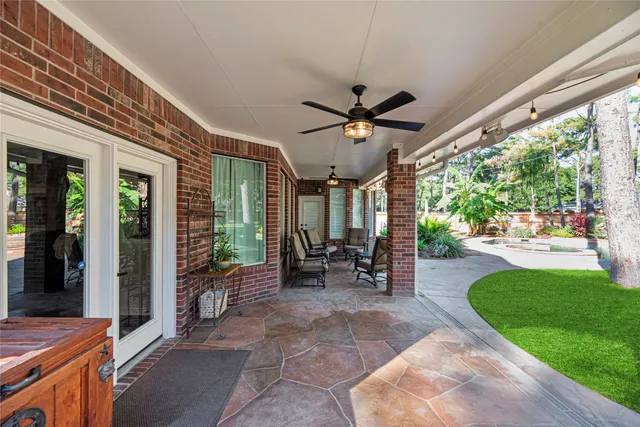 a swimming pool with outdoor seating and yard