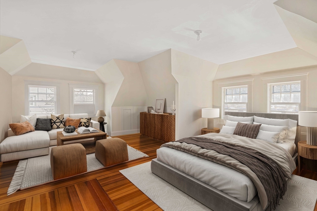 289 Clinton Road Brookline, MA 02445 - Photo 19 of 24 a bedroom with a bed and wooden floor