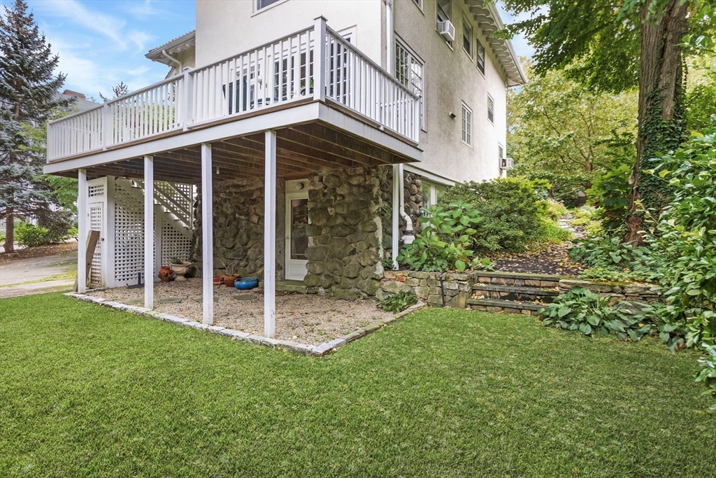 289 Clinton Road Brookline, MA 02445 - Photo 22 of 24 a view of a house with a yard